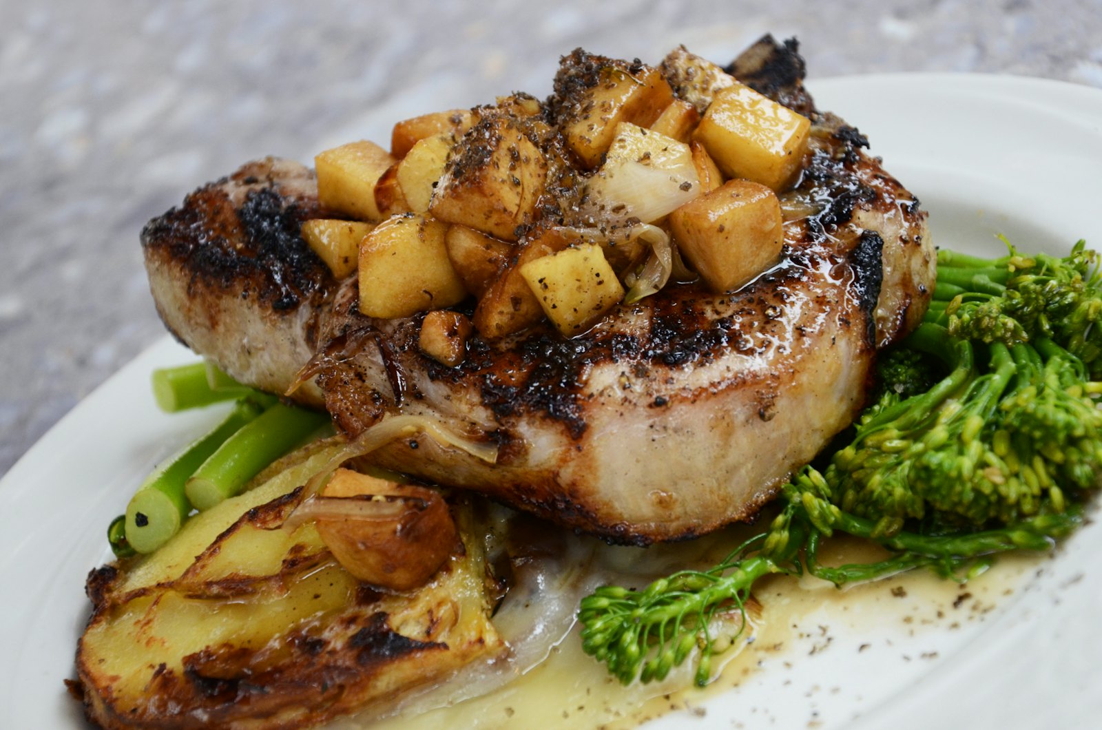 Herb-crusted porchetta sliced on a plate