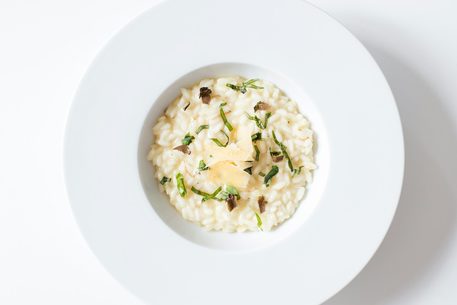 Golden saffron risotto in a shallow bowl