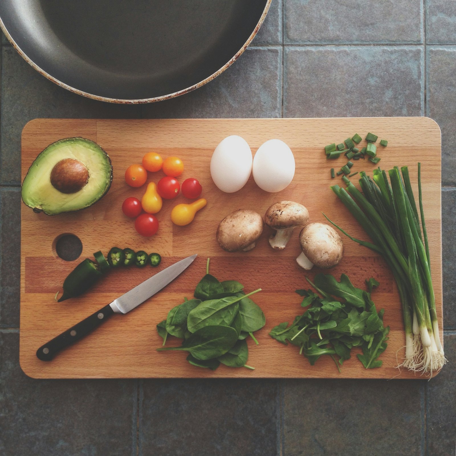 Close-up of a chef plating a dish with tweezers