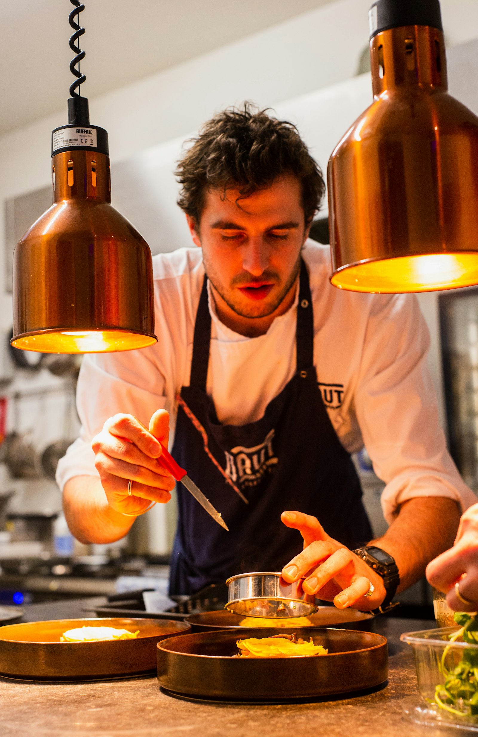 Portrait of Executive Chef Elena Marchetti in the kitchen